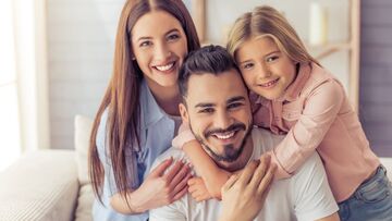 woman, man, child smiling with great teeth