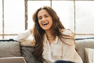 woman laughing showing teeth