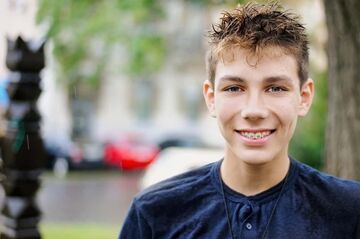 boy smiling showing braces