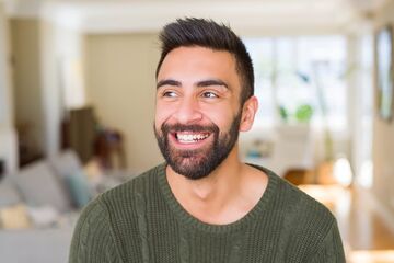 man smiling showing teeth