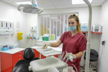 trainee dentist in treatment room